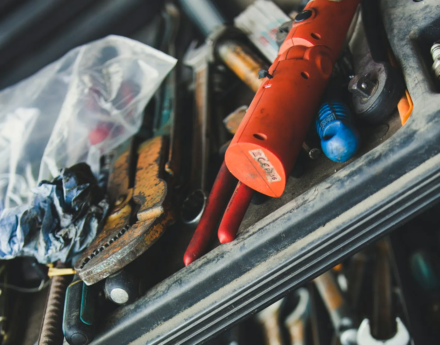 An open tool drawer, spanners and pliers sorted into their compartments.