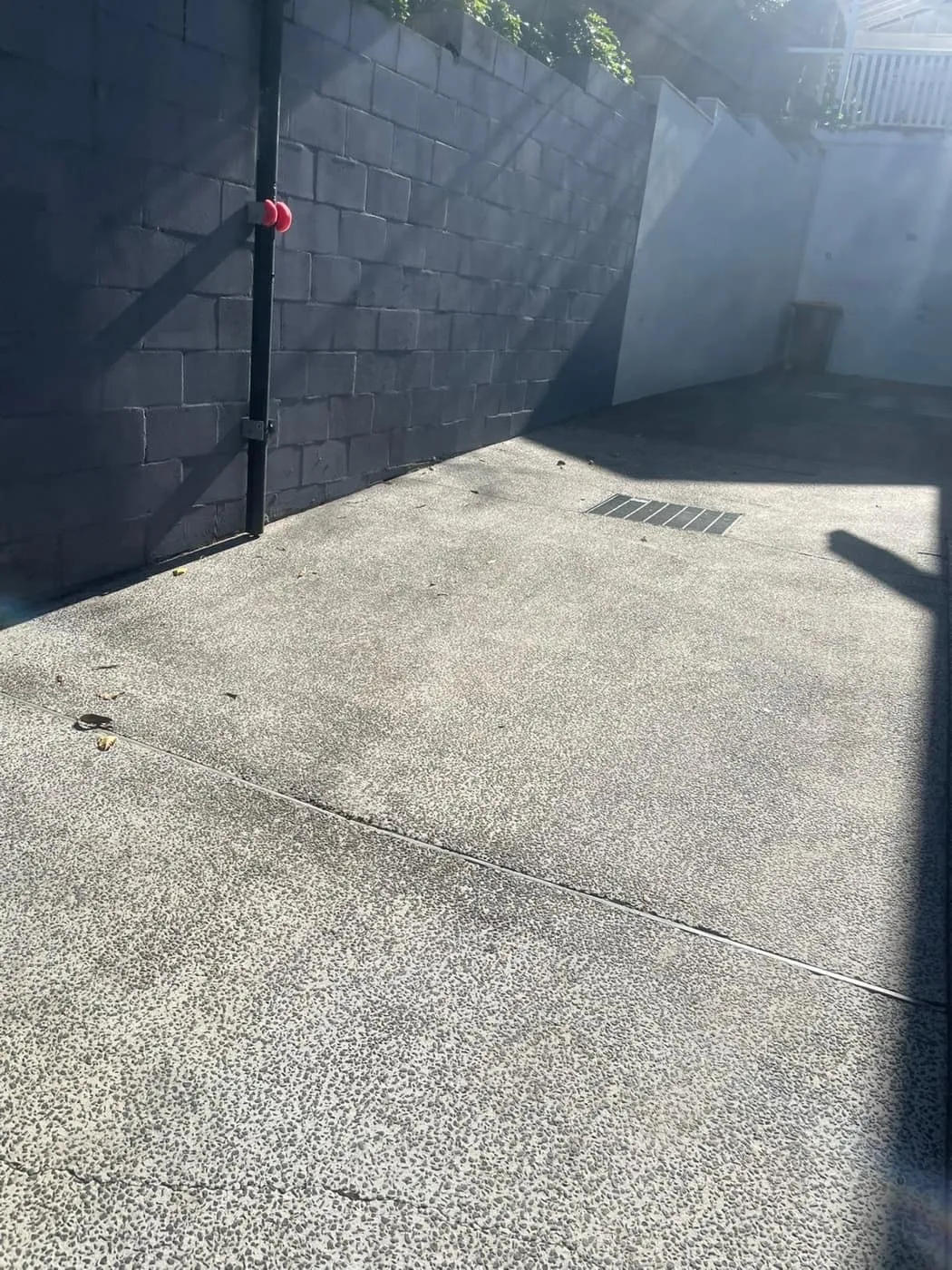 A commercial carpark surface after pressure cleaning, clear of oil stains and grime.